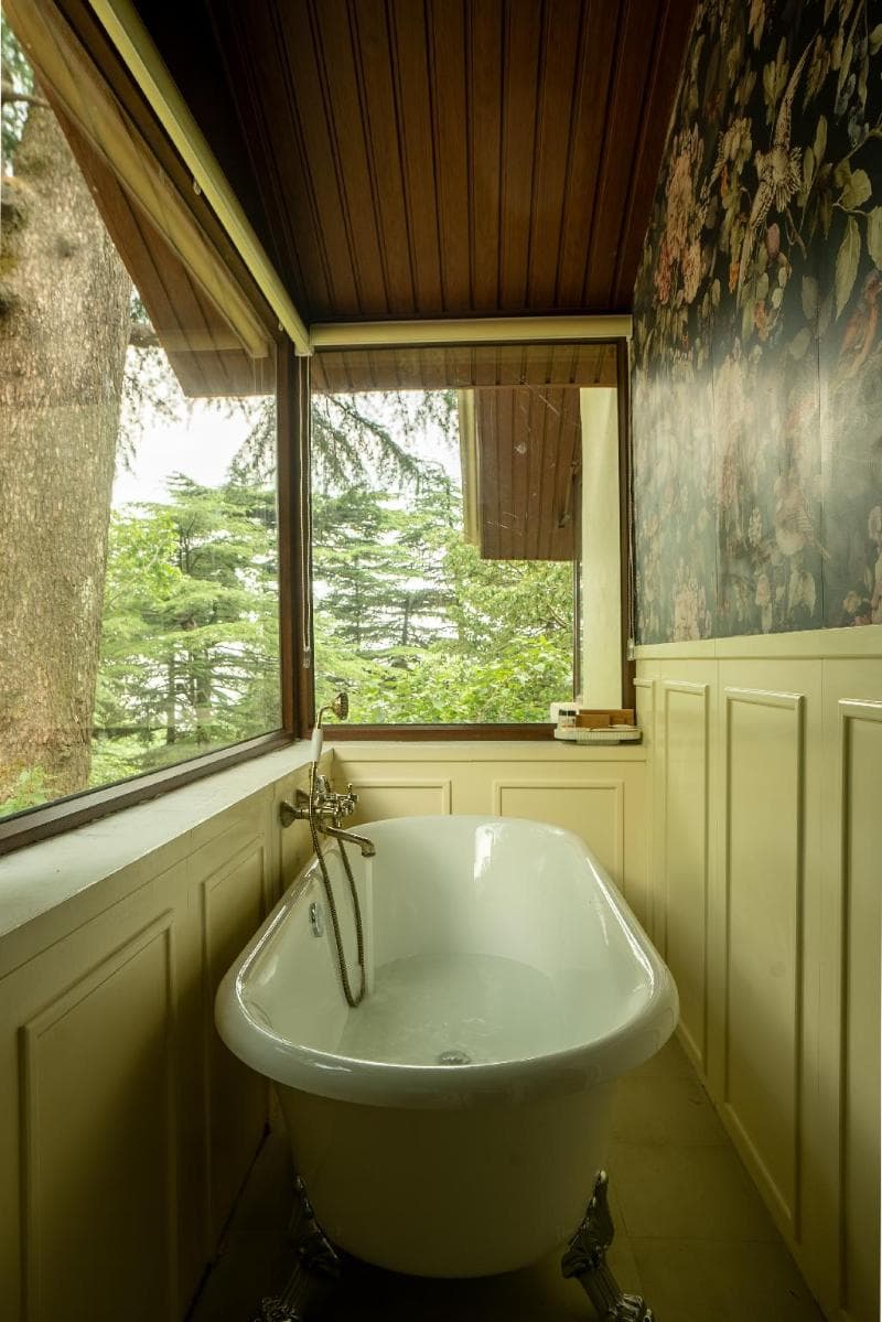 Bathtub beside a window at Monkey Resort